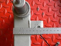 The centre of the attachment point (an 8mm hole) is 25mm from the outside of the square tube.